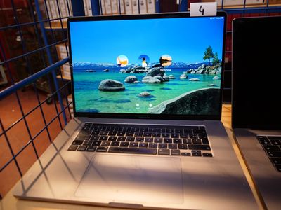 two laptops that are sitting on a table
