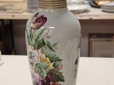 a vase that is sitting on a table in a room
