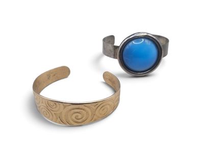 pair of silver and blue stone rings on a white background