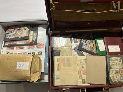 a suitcase full of stamps and other items in it