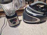 a blender sitting next to a blender on the floor