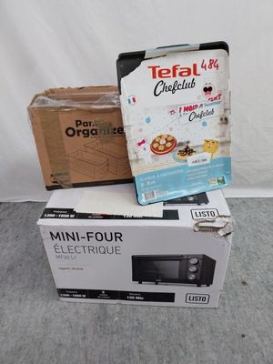 two boxes of food sitting on the floor next to each other