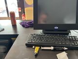 a computer sitting on a desk with a keyboard and mouse