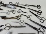 many different types of scissors on the table