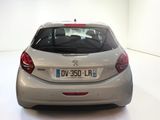 a silver car that is parked in a white room