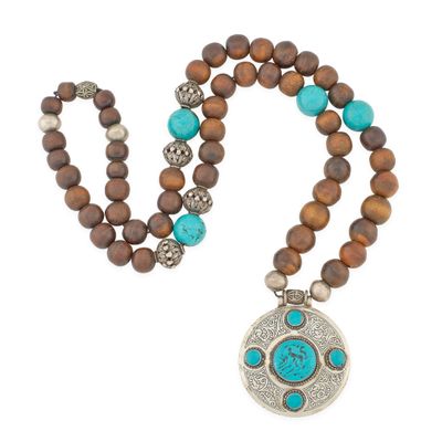 a close up of a necklace on a white background