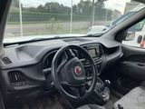 a dashboard and steering wheel of a small car