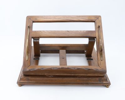 an old wooden magazine holder on a white surface with a white background