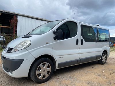 a picture of a silver van parked in a lot