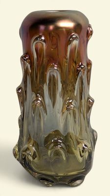 a glass vase that is sitting on a table