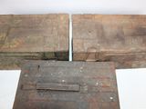 two old wooden boxes sitting next to each other on a table
