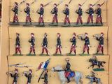 a lot of figurines of soldiers on display in a box