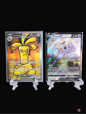 two pokemon cards are on display on a black background