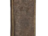 an old book with a brown cover sitting on top of a white surface