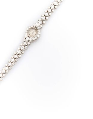 a diamond and white gold bracelet, by cartier