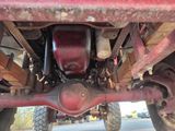 a close up of a red truck ' s rear end
