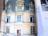 an open book with a picture of a building on it