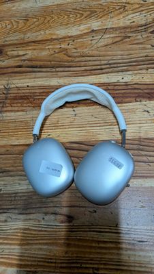 an image of a pair of headphones sitting on top of a wooden floor