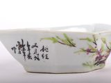 a white bowl with a floral design on it