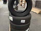 tires stacked on pallets in a warehouse with pallets in the background