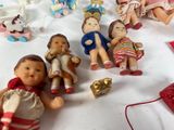 a lot of dolls that are sitting on a table