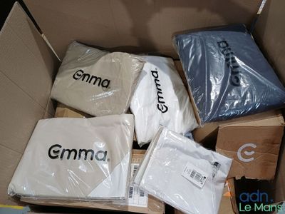 a box full of clothing that is sitting on the floor