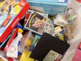 a lot of toys and games in a plastic bag