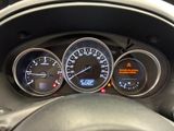 a close up of a car dashboard with various gauges