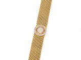 an 18k gold and diamond set wrist watch