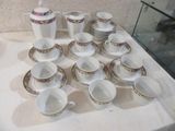 a lot of cups and saucers on the table