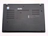 a black laptop with a blue sticker on the back of it