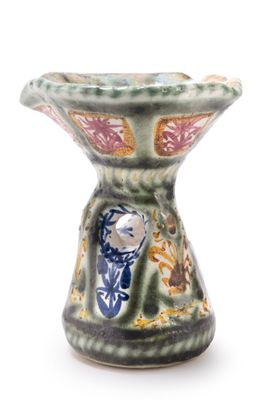 a small vase with a bird on it on a white background