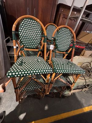 three green and white checkered chairs in a room
