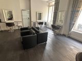 an image of a living room with a lot of furniture