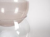 a glass bowl that is sitting on top of a table