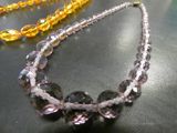 two necklaces that are sitting on a table