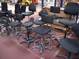 a lot of chairs and stools in a warehouse