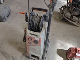 a machine that is sitting on the floor in the garage