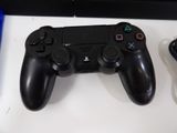 a video game controller sitting on a table next to a game controller