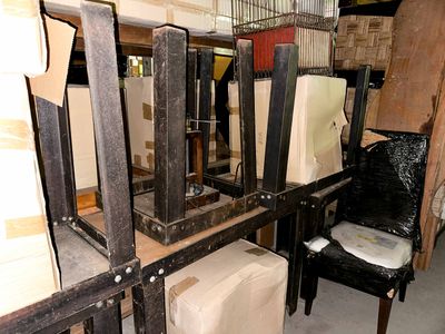 many pieces of furniture that are stacked on the shelves