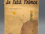 un vieux livre avec l'image d'un petit garçon au sommet d'une colline