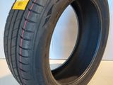 a close up of a tire on a white surface