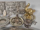 a lot of silver items that are on a table