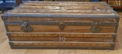 a trunk that is sitting on the floor in a room