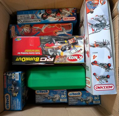 a box full of legos and other toys in it