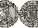 a close up of a coin with a crown on top of it