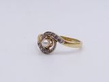 an image of a diamond and pearl ring on a white surface