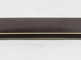 a close up of a wallet on a table with a white background