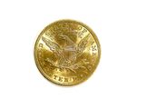 an image of a gold coin on a white surface