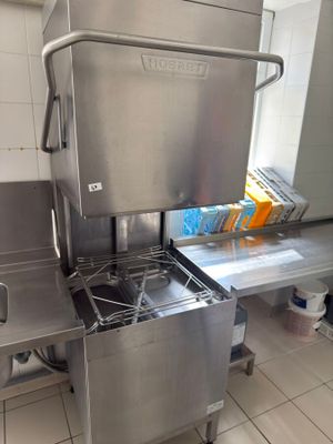 a stainless steel kitchen with a stove and a sink